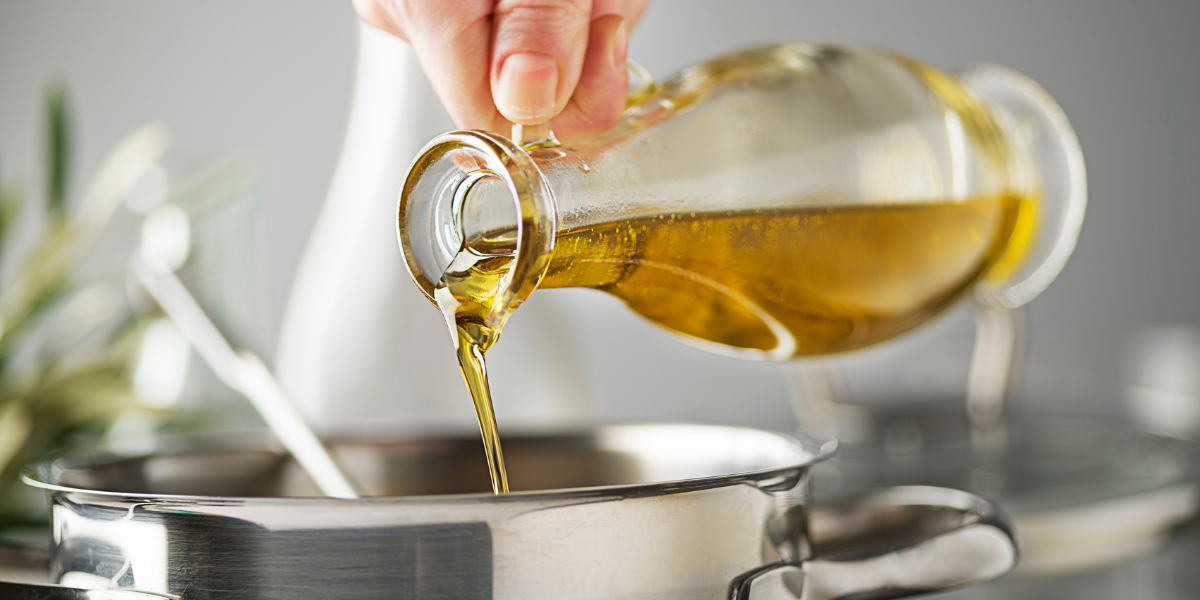 Pouring Picual Oil into a cooking pot