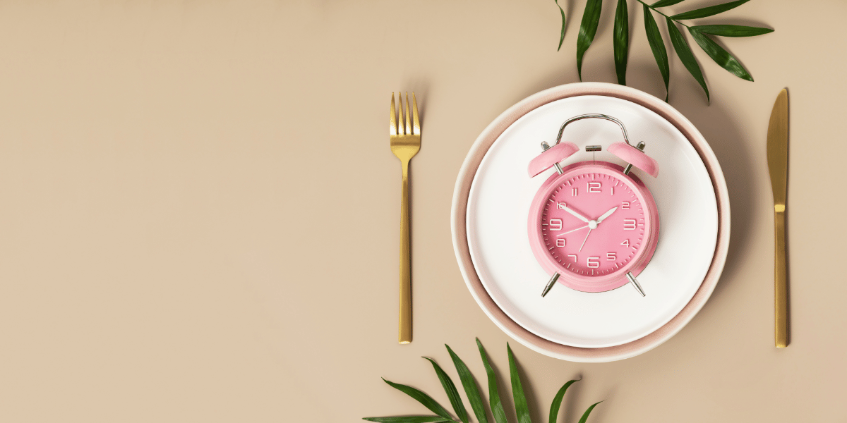 a clock on a place setting