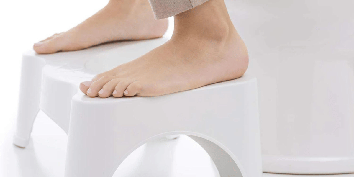 feet on the squatty potty device