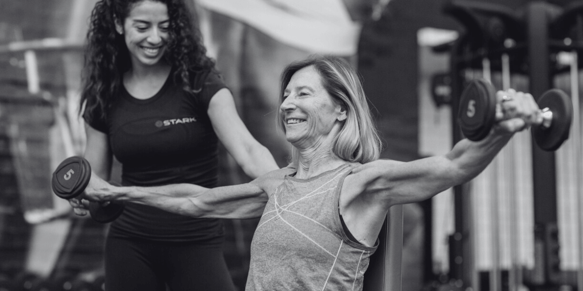 A Stark trainer working out with a student for personal training